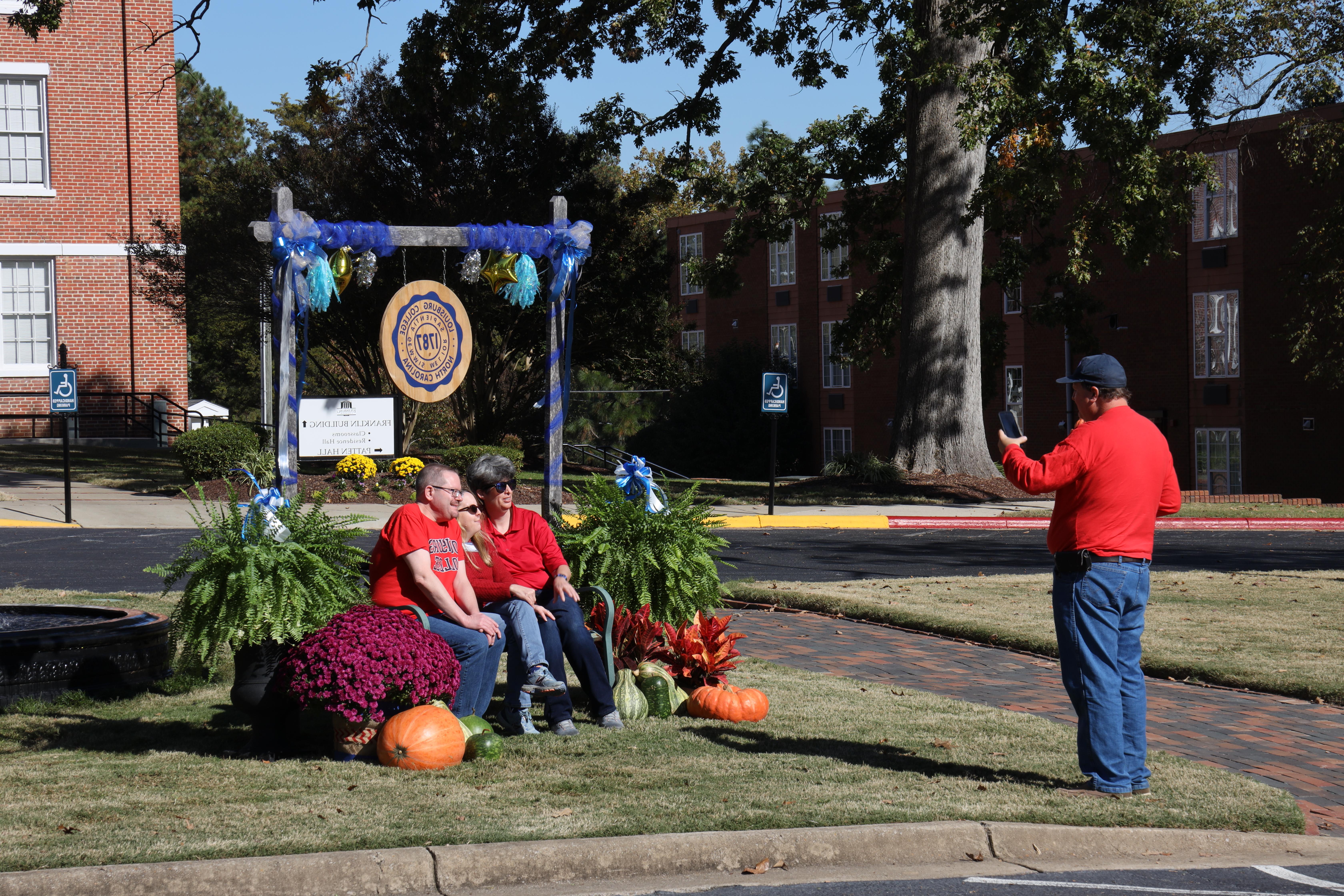 Alumni taking pictures during Homecoming 2022